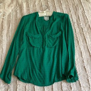 Maeve emerald blouse from Anthropologie.